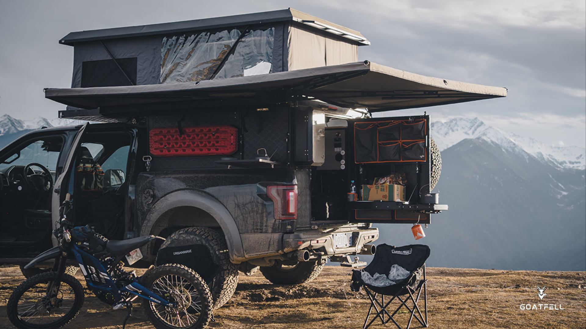 demountable camper unit in the wilderness with mountains in the background