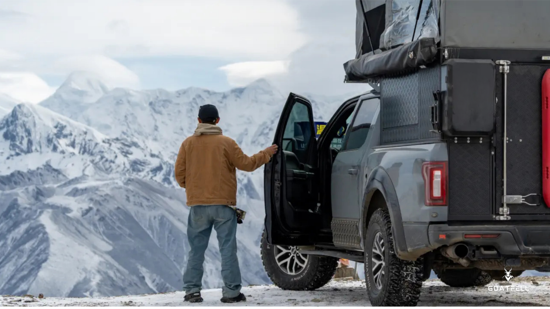 View to the rear of a demountable camper unit on the back of the pick up truck 